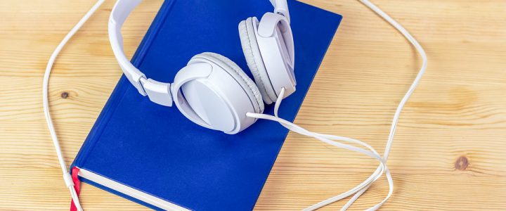 The art of listening - headphones on a book