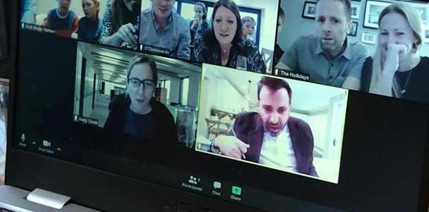 A group running a virtual murder mystery on screen